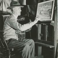 A painter working at his easel