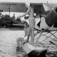 Margaret and George Potts take a break on one of Margaret's seaplanes. 