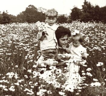 Leo Bock’s wife, Lillian Bock and their two children, Walter and Marie in a field of daisies in Lynbrook, NY. Circa 1912. 