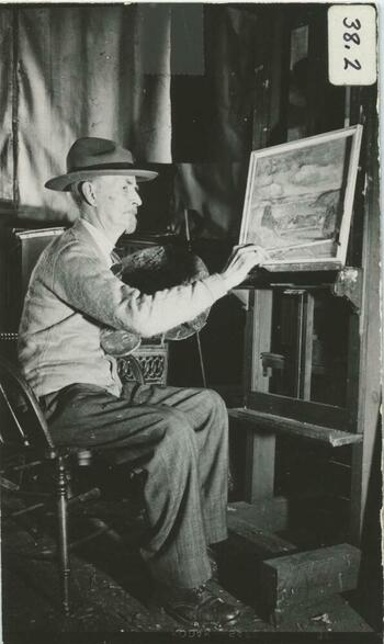 A painter working at his easel