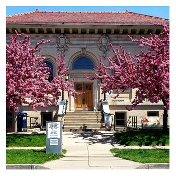 springtime photo of the front of Hornell Public Library